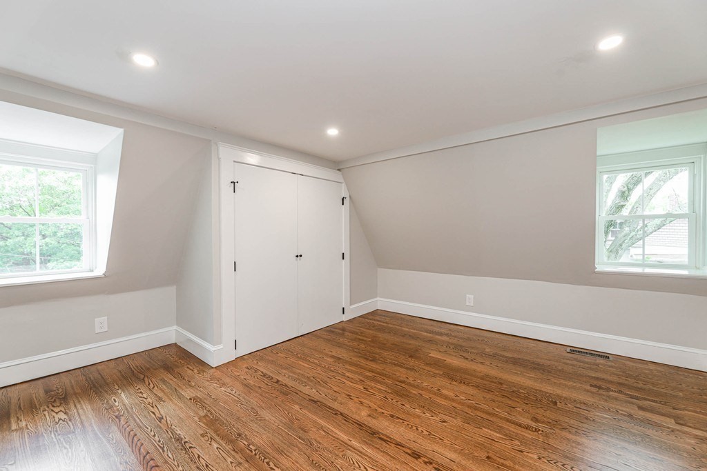 52 Maple Street, Unit 2 Boston, MA 02136 - Photo 32 of 41 an empty room with wooden floor and windows
