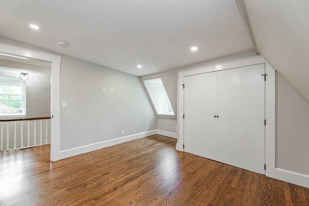 52 Maple Street, Unit 2 Boston, MA 02136 - Photo 33 of 41 an empty room with wooden floor and windows