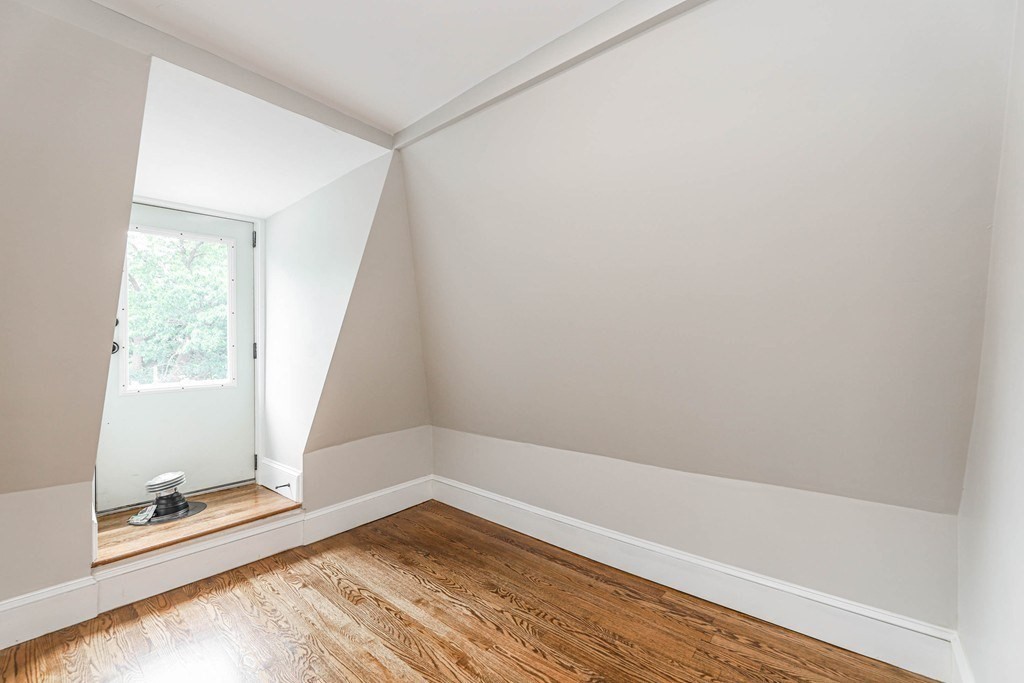 52 Maple Street, Unit 2 Boston, MA 02136 - Photo 36 of 41 a view of a small space with wooden floor and a window