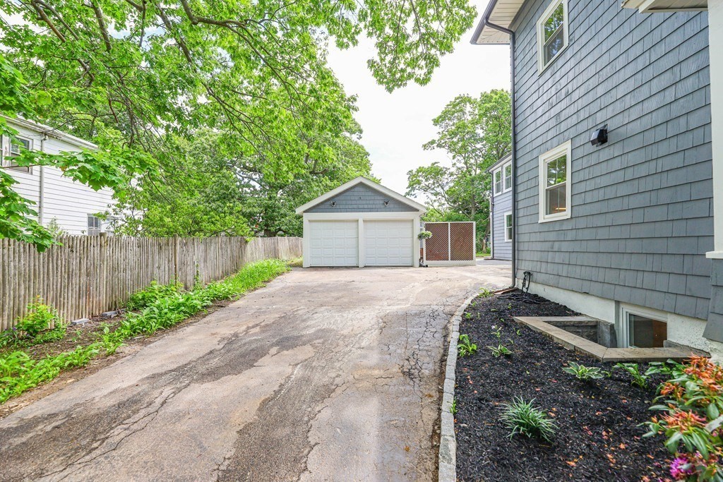 52 Maple Street, Unit 2 Boston, MA 02136 - Photo 38 of 41 a front view of a house with garden