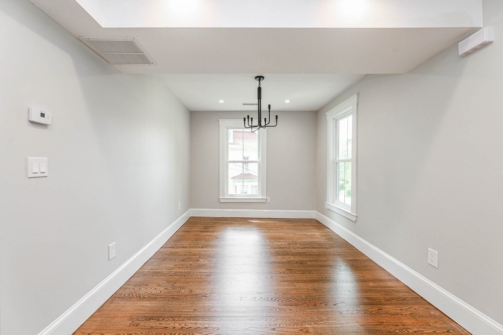52 Maple Street, Unit 2 Boston, MA 02136 - Photo 10 of 41 wooden floor in an empty room with window