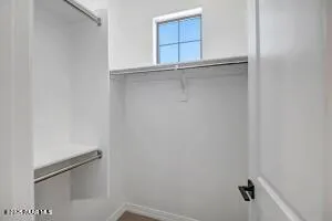 a view of a hallway with closet