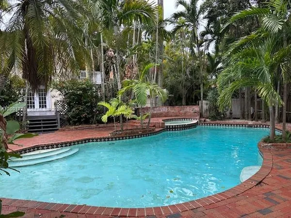 a view of a swimming pool with a garden