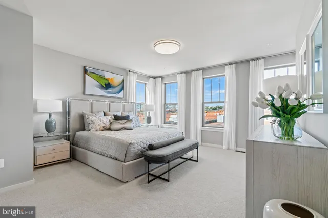 a bedroom with a bed and a couch