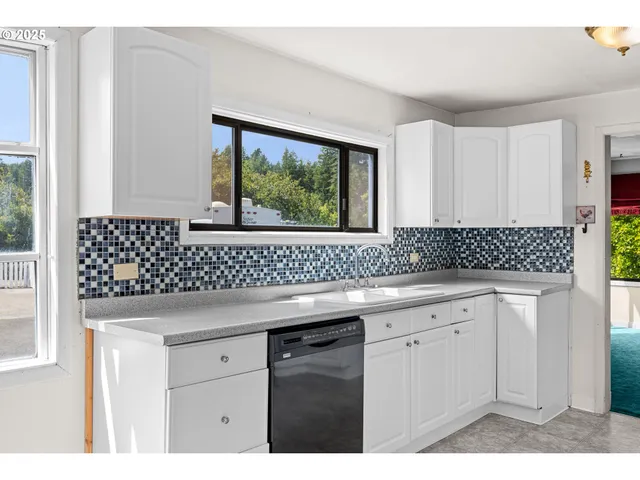 a kitchen with a sink and cabinets