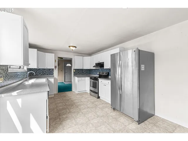 a kitchen with refrigerator cabinets and a counter top