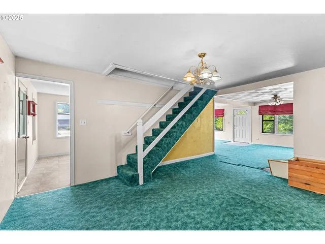 a view of an entryway with a front door