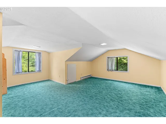 a view of an empty room with windows