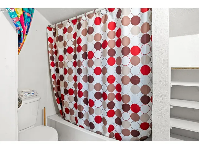 a bathroom with a bathtub and a sink