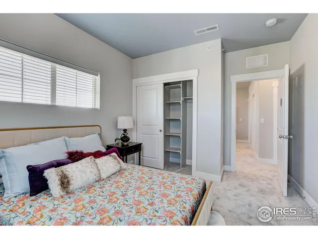 a bedroom with a bed and a cabinets