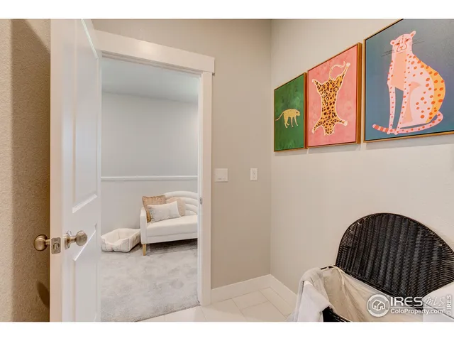 a living room with furniture and a walk in closet