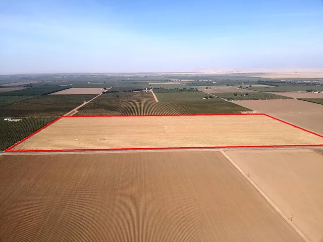 an outdoor space with view of city