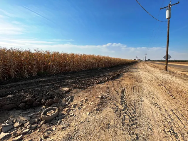 a view of a water with a house in the background