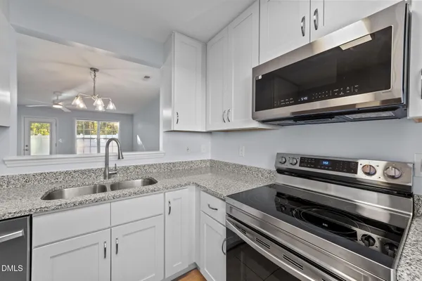 a kitchen with a stove and a microwave