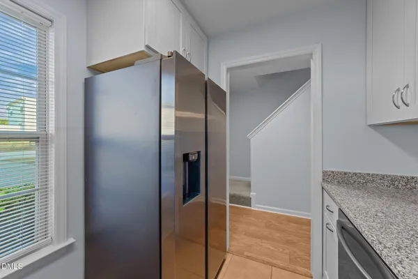 a view of a kitchen from the hallway