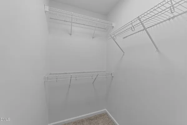 a view of a room with racks on the wall