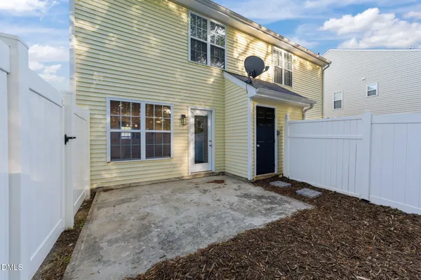 a front view of a house with a large window