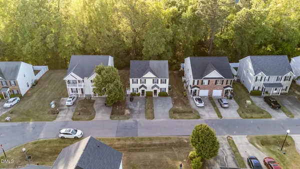 an aerial view of a house with swimming pool