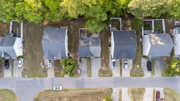 aerial view of a house with a yard