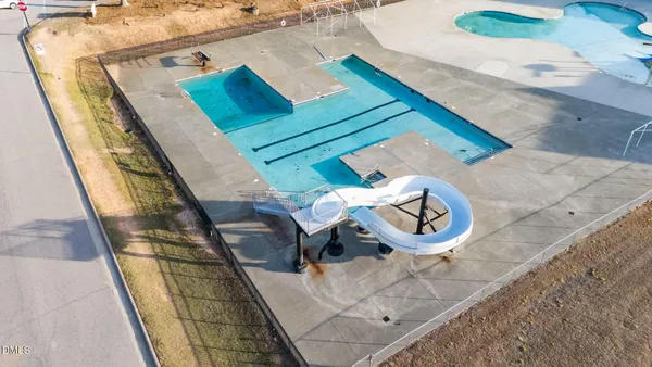 an aerial view of a house with outdoor space