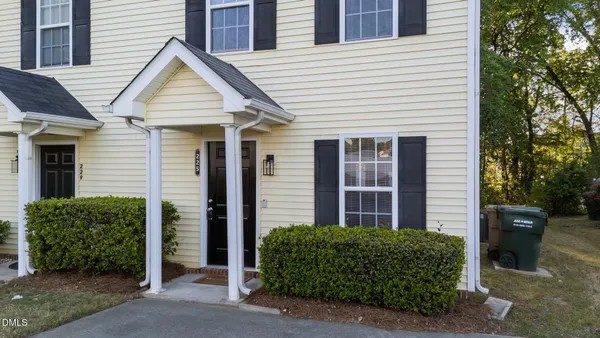 a view of a house with brick walls
