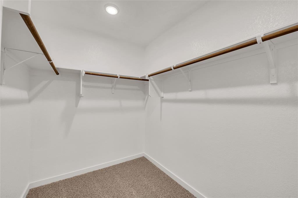 262 Boatright Boulevard Jarrell, TX 76537 - Photo 10 of 30 Walk in closet featuring carpet floors