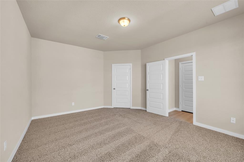 262 Boatright Boulevard Jarrell, TX 76537 - Photo 13 of 30 Unfurnished bedroom featuring light colored carpet