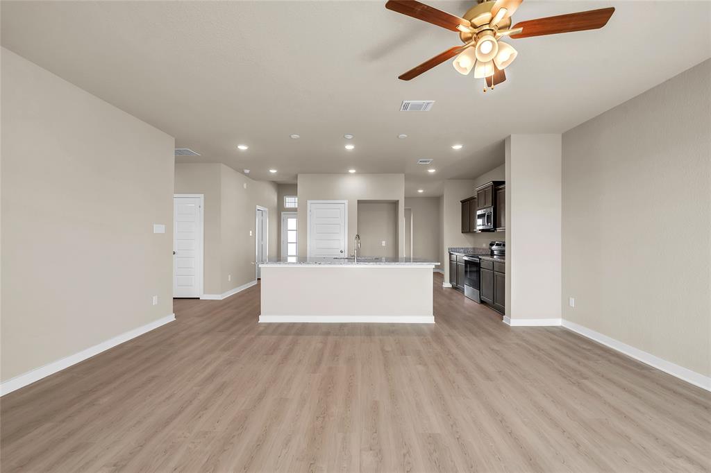 262 Boatright Boulevard Jarrell, TX 76537 - Photo 14 of 30 Unfurnished living room featuring recessed lighting, a ceiling fan, and light wood-type flooring