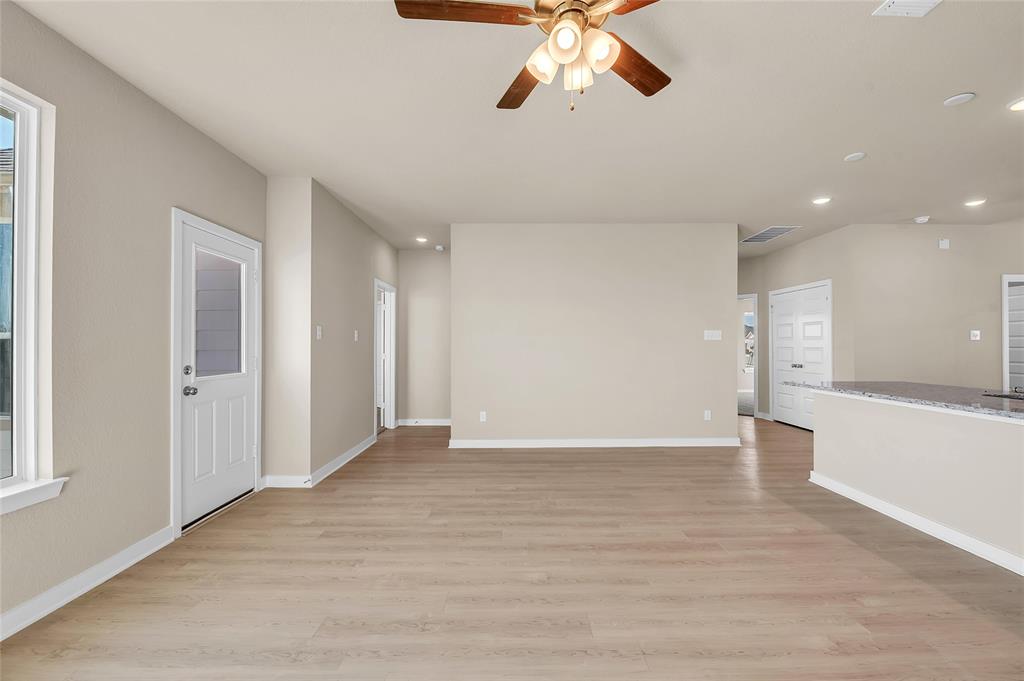 262 Boatright Boulevard Jarrell, TX 76537 - Photo 16 of 30 Unfurnished living room with recessed lighting, light wood finished floors, and a ceiling fan