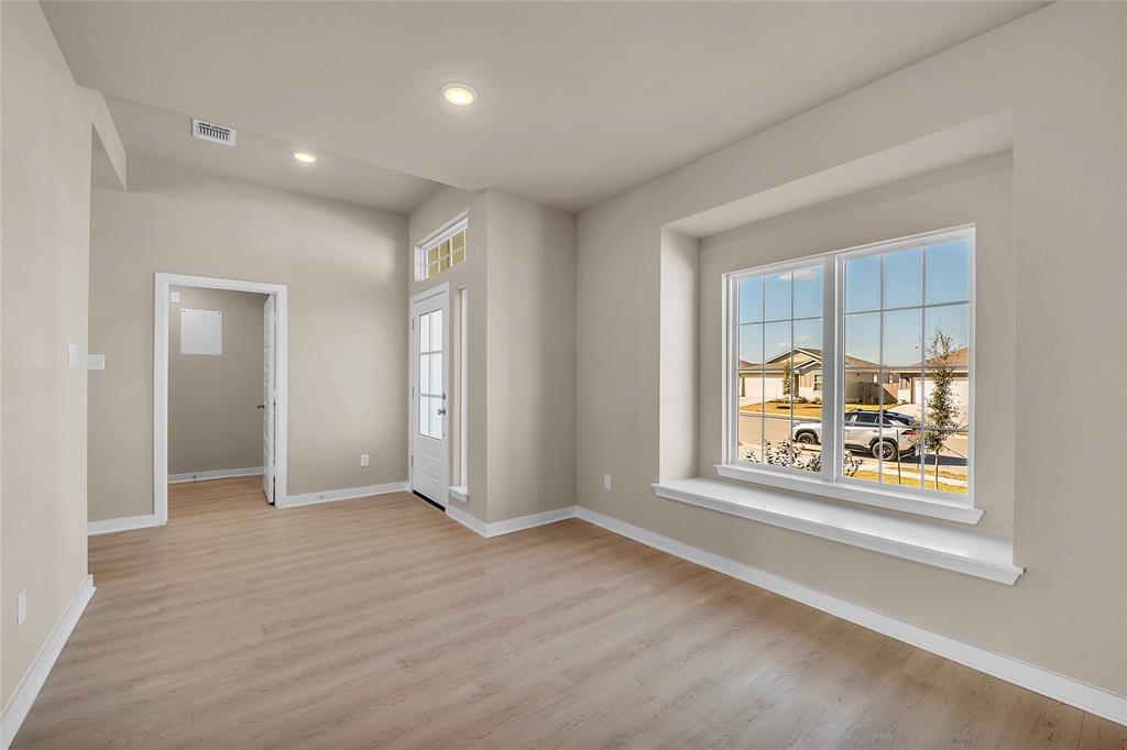 262 Boatright Boulevard Jarrell, TX 76537 - Photo 20 of 30 Empty room featuring light wood-type flooring and recessed lighting