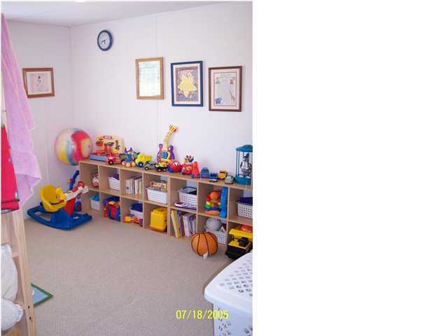 5097 Keyser Mill Road Baker, FL 32531 - Photo 6 of 10 a children room with toys