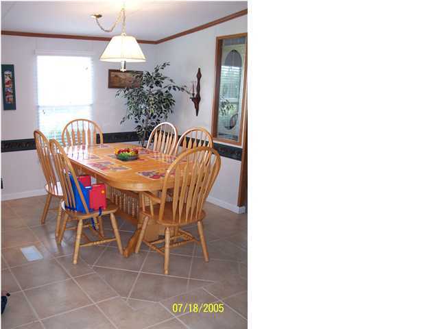 5097 Keyser Mill Road Baker, FL 32531 - Photo 10 of 10 a view of a dining room with furniture