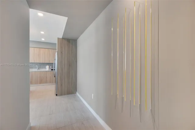 a view of a hallway with an entryway