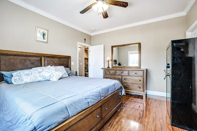 a bedroom with a bed and a dresser