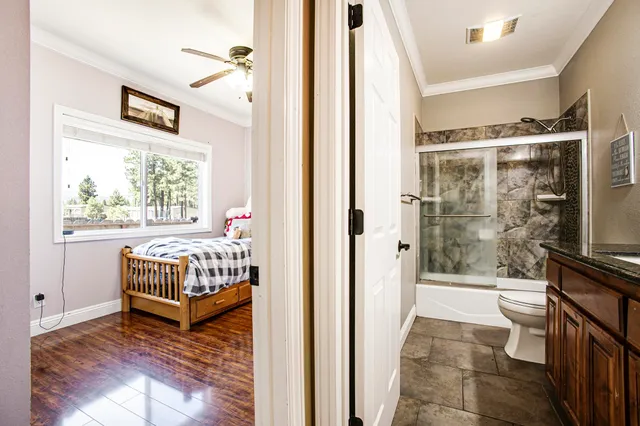a bedroom with a bed and a view of bathroom