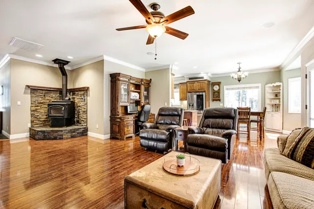 a living room with furniture fireplace and a flat screen tv