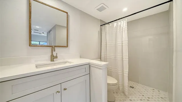 a view of a house with backyard sitting area and garden