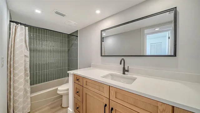 a view of a chair and table in the garden