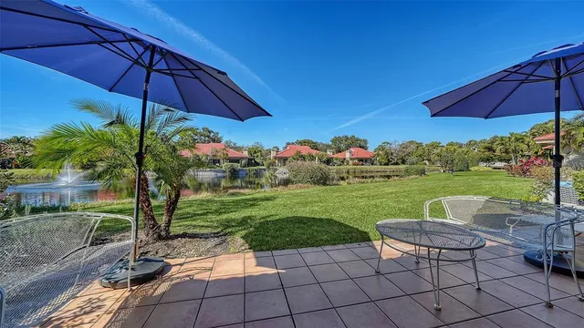 a view of a lake with a house in the background