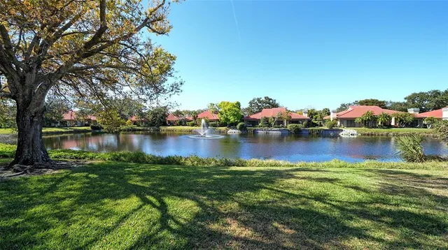 swimming pool view with a seating space