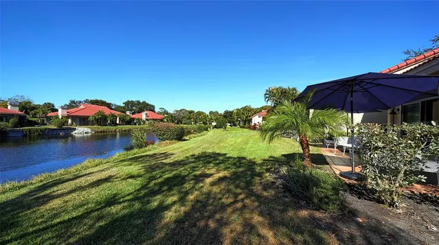 a view of balcony with wooden floor and outdoor seating
