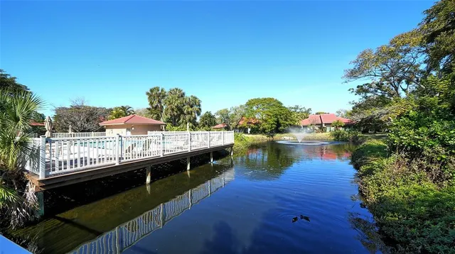 a kitchen with stainless steel appliances sink stove microwave and cabinets