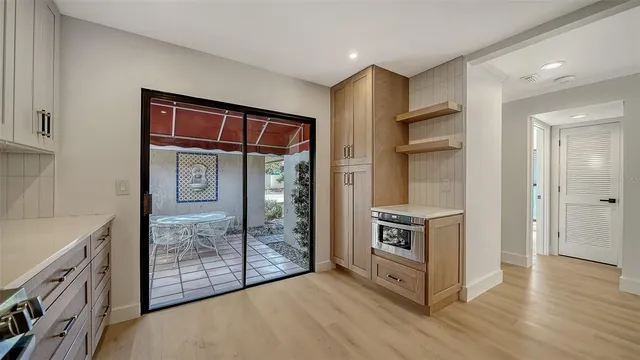 a kitchen with stainless steel appliances granite countertop a refrigerator and a stove
