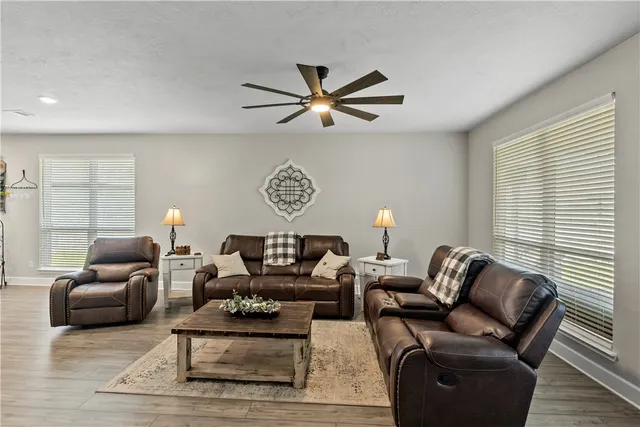 a living room with furniture and a window
