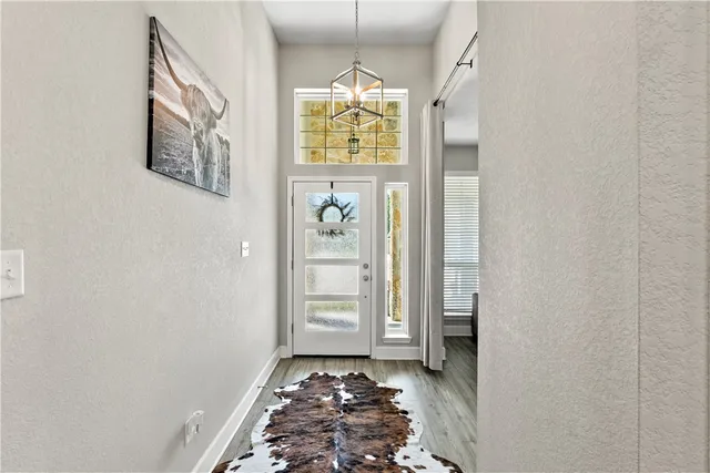 a kitchen with sink stove and refrigerator