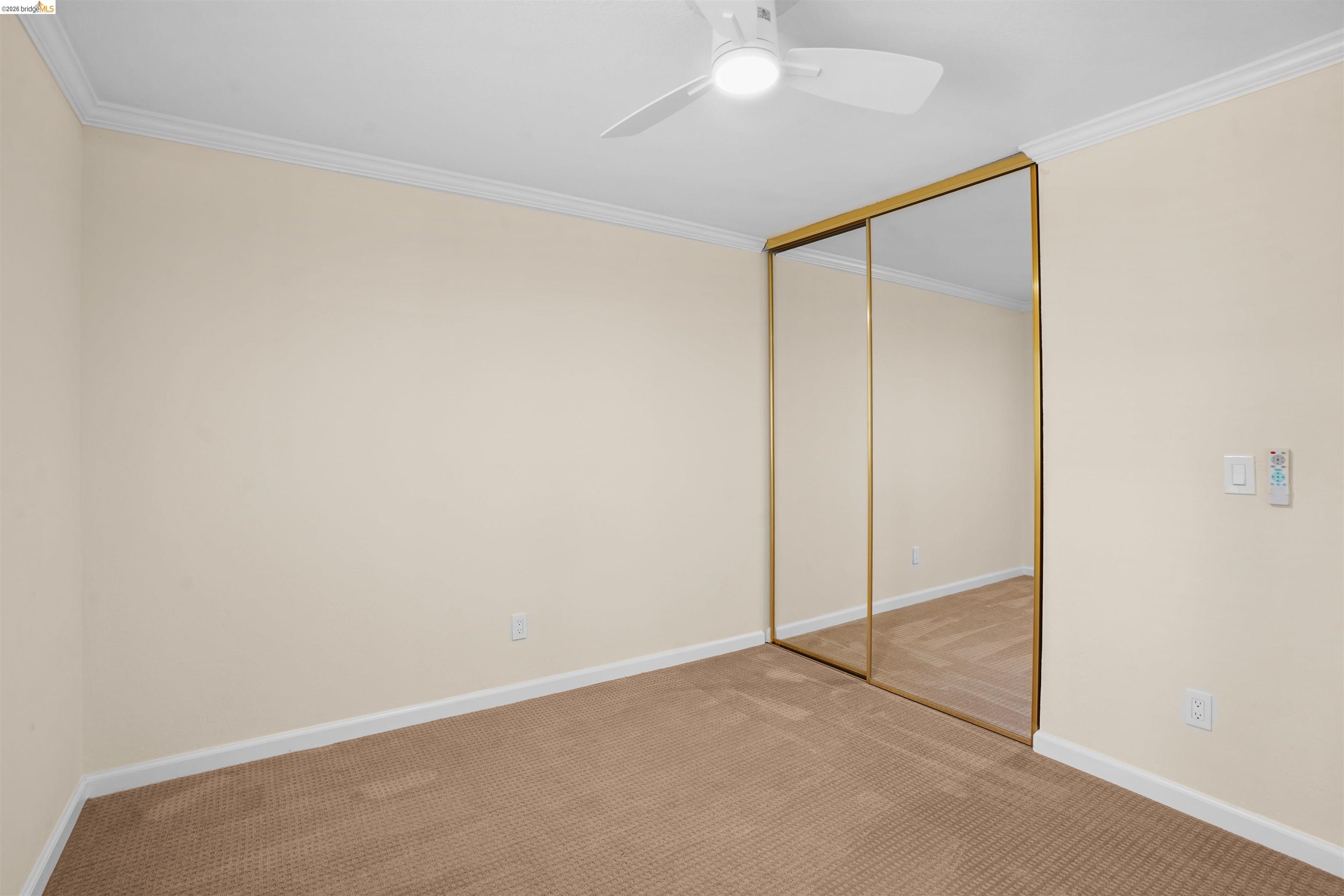 1505 Kirker Pass Road, Unit 214 Concord, CA 94521 - Photo 43 of 55 Wall-to-wall carpeting in a neutral tone, complemented by a white ceiling and crown molding