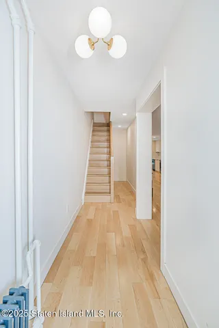 a kitchen with a stove a sink and a refrigerator