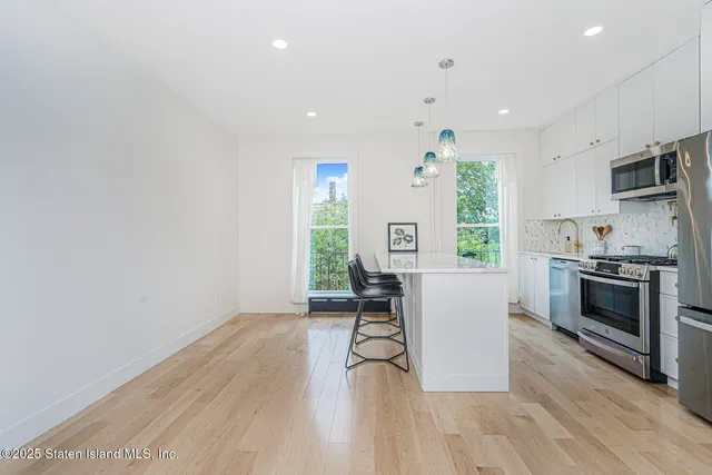 a view of backyard with a deck