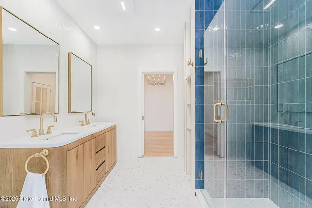 a kitchen with appliances a sink and cabinets