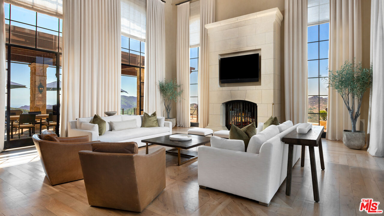 340 Kanan Dume Road Malibu, CA 90265 - Photo 13 of 57 a living room with fireplace furniture and a fireplace